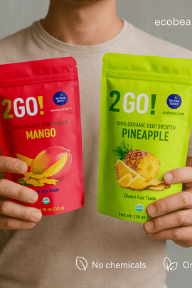 2GO! Organic Dehydrated Mango and Pineapple – two resealable pouches with clean background, product features marked with 'no chemicals', 'organic products', and ecobeaut.com branding