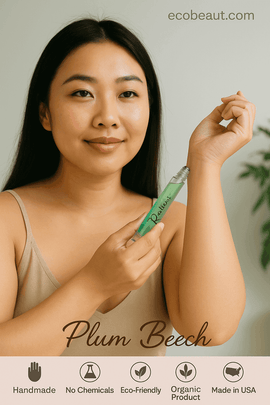 Asian woman applying Resilient perfume by Plum Beech to wrist – natural and organic roll-on fragrance with eco certifications and branding from ecobeaut.com