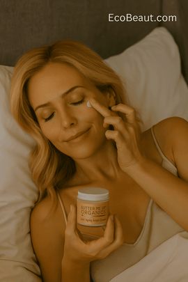 Blonde woman in bed applying Butter Me Up Organics Anti-Aging Night Cream before sleep, natural organic skincare routine for nighttime hydration, EcoBeaut.com branding