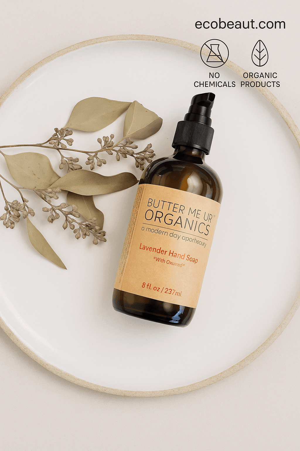 : Butter Me Up Organics Lavender Hand Soap with oatmeal placed on a ceramic plate with eucalyptus sprigs, featuring “NO CHEMICALS,” “ORGANIC PRODUCTS” icons, and ecobeaut.com in the top right corner.