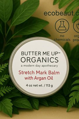 Butter Me Up Organics Stretch Mark Balm with Argan Oil placed among lush green leaves, organic skincare, eco-friendly, ecobeaut.com