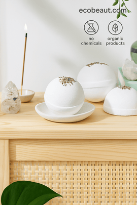 Butter Me Up Organics bath bombs with dried botanicals on a wooden shelf – natural relaxation, organic ingredients, chemical-free