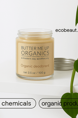 Butter Me Up Organics deodorant jar on white shelf with green plants, “no chemicals” and “organic products” labels at the bottom, and ecobeaut.com in the top right corner.