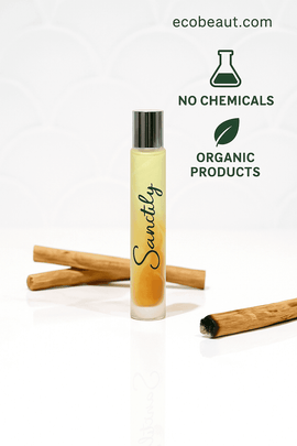 Sanctify Rollerball Perfume - Palo Santo, Bergamot, Patchouli & Cedarwood in a natural setting with cinnamon sticks.