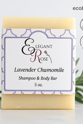 Elegant Rose Lavender Chamomile Shampoo Bar with ecobeaut.com, No Chemicals, Organic Products labels and green sprigs on a light background.