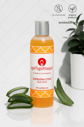 Energizing Citrus Body Wash by A Girl’s Gotta Spa! displayed with aloe vera and natural decor – sulfate-free organic cleanser, ecobeaut.com