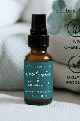 Eucalyptus & Spearmint aromatherapy spray bottle surrounded by soft natural fabrics and eucalyptus leaves – organic essential oil spray, no chemicals, ecobeaut.com