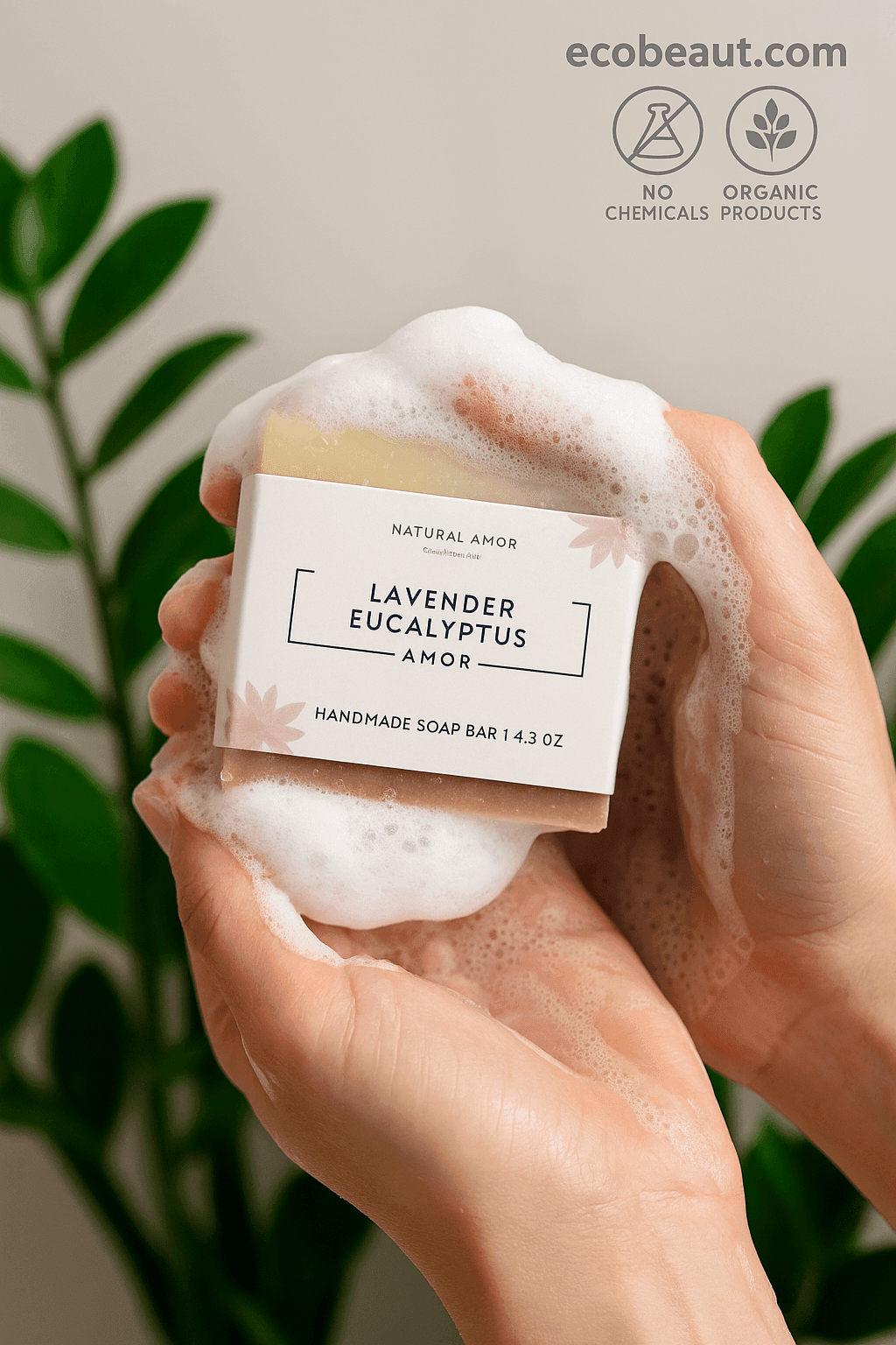 Hands lathering Lavender Eucalyptus Amor soap bar with soft foam, greenery in the background, and ecobeaut.com with clean product icons in the top right corner.