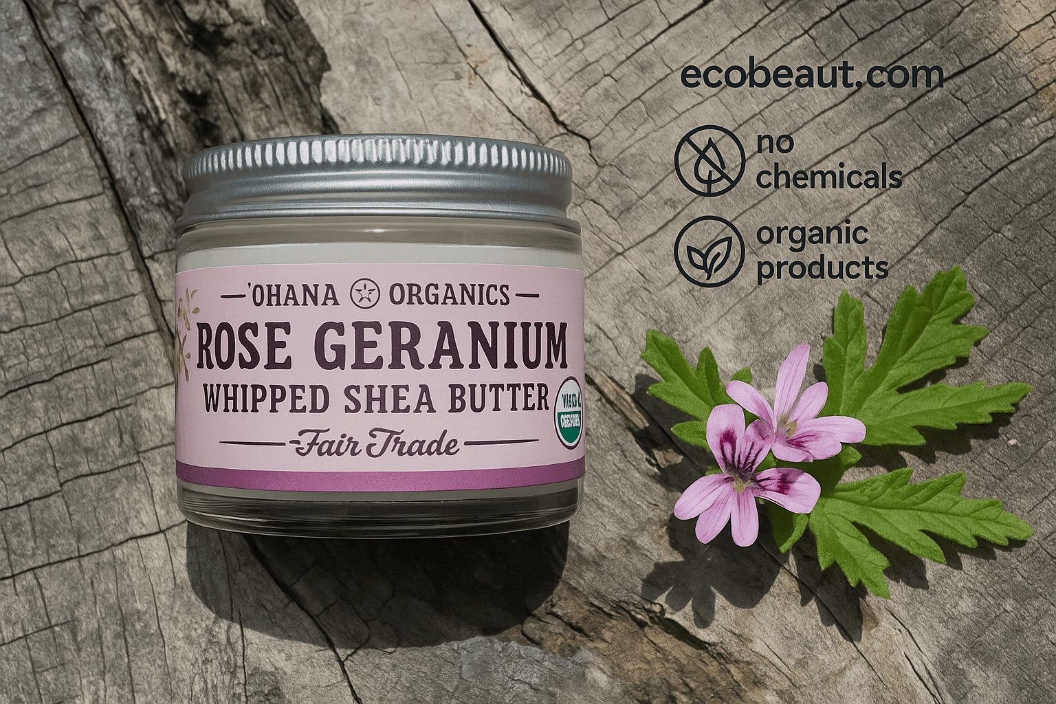 Ohana Organics Rose Geranium Whipped Shea Butter jar on a rustic wooden surface, featuring a silver lid and lavender label, surrounded by pink flowers and green leaves with ecobeaut.com, no chemicals, and organic products icons in the top right corner