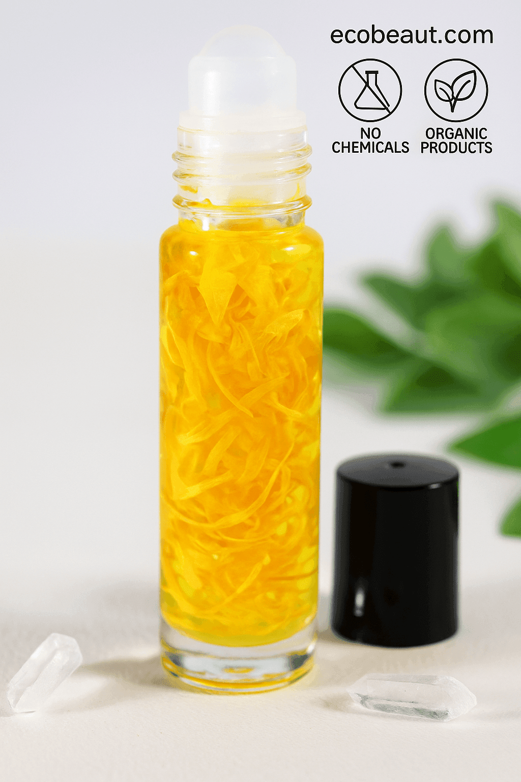 "Roll-on bottle filled with golden oil and flower petals, on white surface with crystals, eco labels, and ecobeaut.com branding in the top right corner."