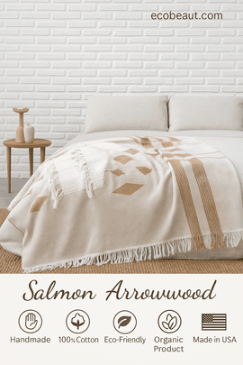 Salmon Arrowwood organic cotton throw blanket with geometric patterns on a modern bed, handmade and eco-friendly design