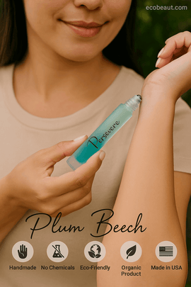 Smiling woman applying Persevere roll-on perfume by Plum Beech to wrist – organic, handmade fragrance with eco labels and branding from ecobeaut.com