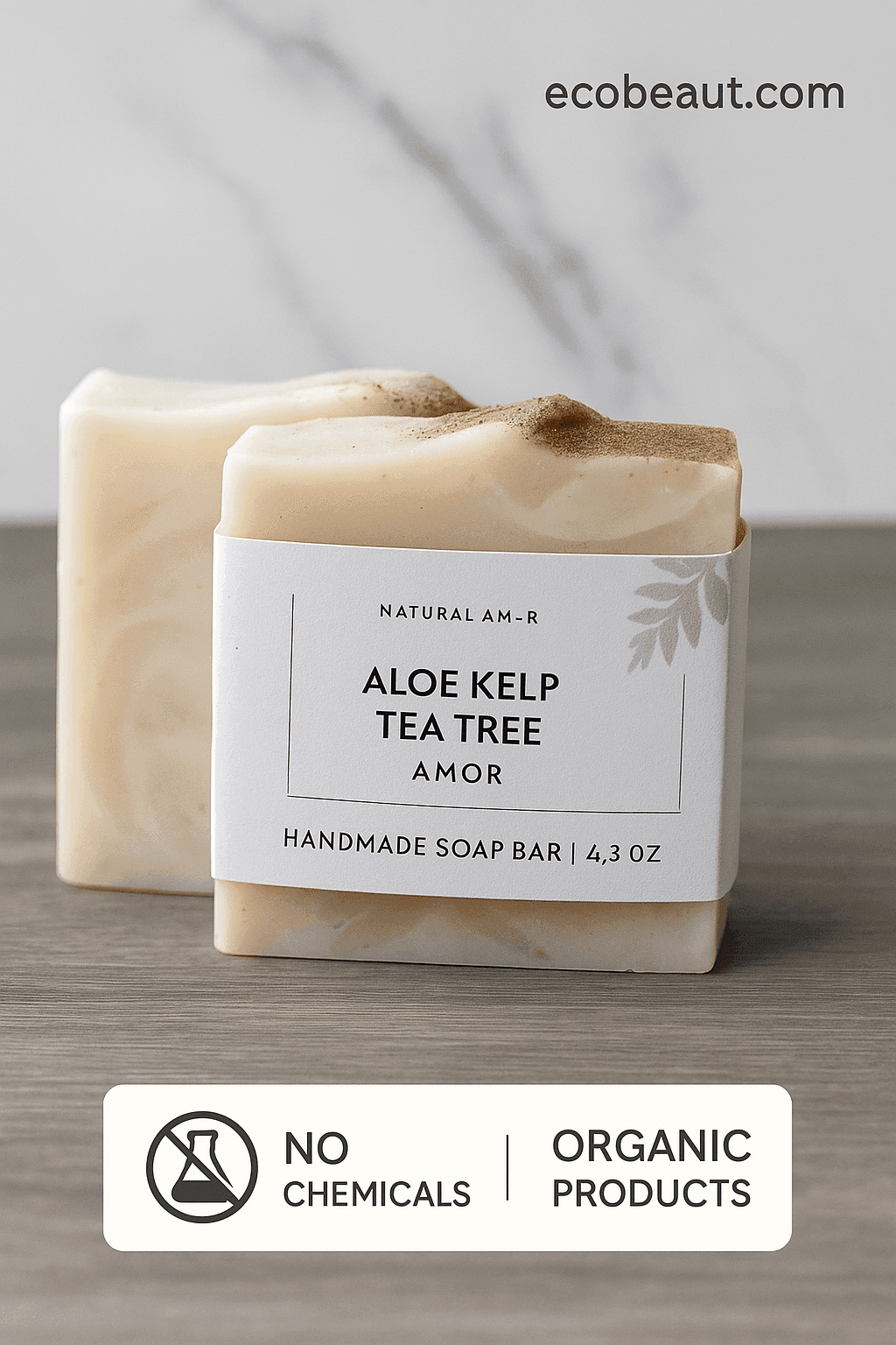 Two handmade Aloe Kelp Tea Tree soap bars with minimalist white labels placed on a wooden surface against a marble background. The image includes the website ecobeaut.com in the top right and eco-labels 'NO CHEMICALS' and 'ORGANIC PRODUCTS' at the bottom.