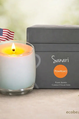 Sanari pomelo candle with packaging and American flag on a blurred natural background