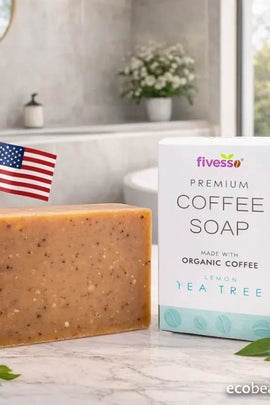 Bar of coffee soap with packaging and lemon on a bathroom counter
