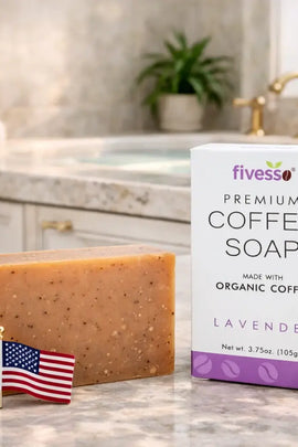 Bar of coffee soap with a box labeled 'fivesso Premium Coffee Soap' on a bathroom counter.