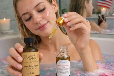 Young woman applying natural face serum and acne care oil in bath setting with organic skincare products on Ecobeaut.com