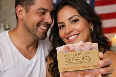 Couple holding organic handmade soap from Butter Me Up Organics on Ecobeaut.com with USA flag background