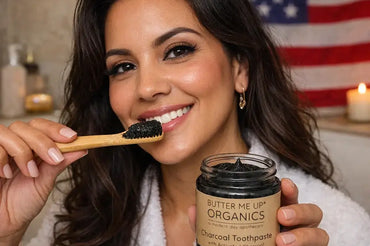 Woman brushing teeth with organic charcoal toothpaste from Butter Me Up Organics on Ecobeaut.com