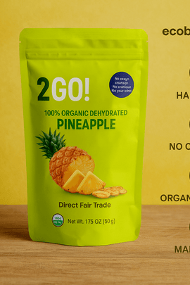 2GO! Organic Dehydrated Pineapple – close-up of eco-friendly resealable packaging with dried pineapple slices, labeled 'Handmade', 'No Chemicals', 'Eco-Friendly', 'Organic Product', 'Made in USA', ecobeaut.com branding