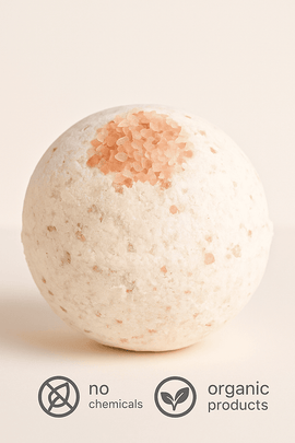 Bath bomb with natural texture on a beige background, featuring 'no chemicals' and 'organic products' labels.