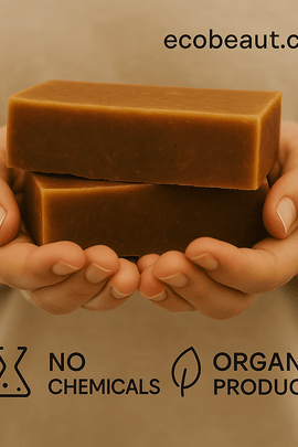 A person gently holds two Cinnamon Honey and Almond Soap bars with ecobeaut.com in the top right and eco labels 'NO CHEMICALS' and 'ORGANIC PRODUCTS' displayed at the bottom.