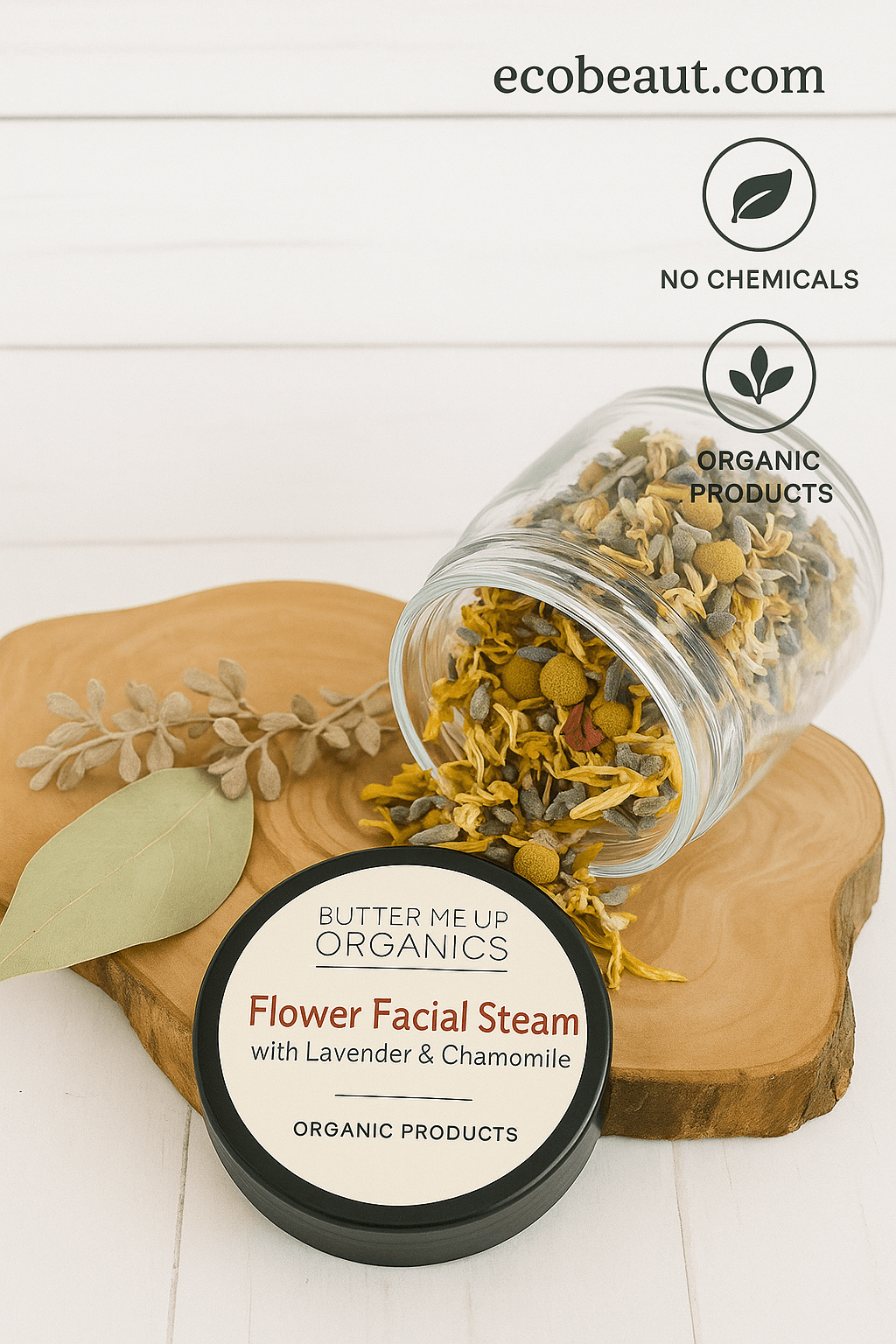 A presentation of Flower Facial Steam from Butter Me Up Organics, featuring a black tin with a cream label placed on a rustic wooden surface. Dried chamomile, rose petals, and lavender are scattered beside the container. In the top right corner, the website ecobeaut.com is displayed along with neat labels “no chemicals” and “organic products,” emphasizing the product’s purity and natural origin.








