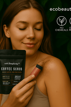 A woman applies coffee scrub to her shoulder while holding a black pouch labeled “Coffee Scrub – Green Coffee and Raw Sugar,” with green leaves in the background and “ecobeaut.com,” “NO CHEMICALS,” and “ORGANIC PRODUCTS” icons in the top right corner.