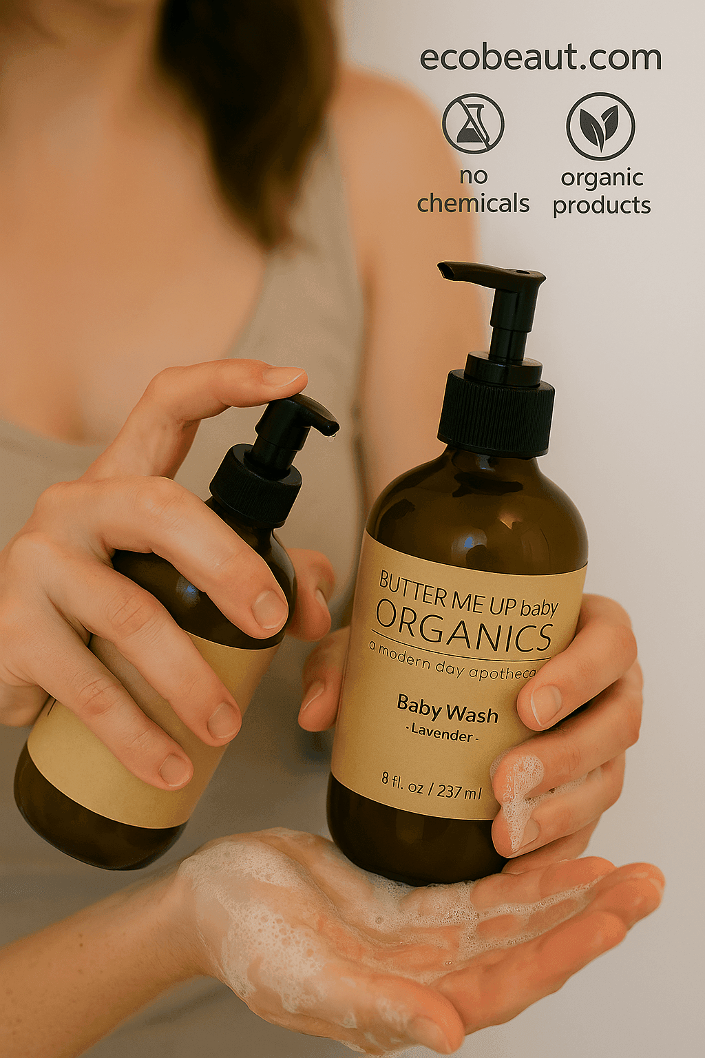 Butter Me Up Baby Organics Baby Wash being held with a visible brand logo in the corner.