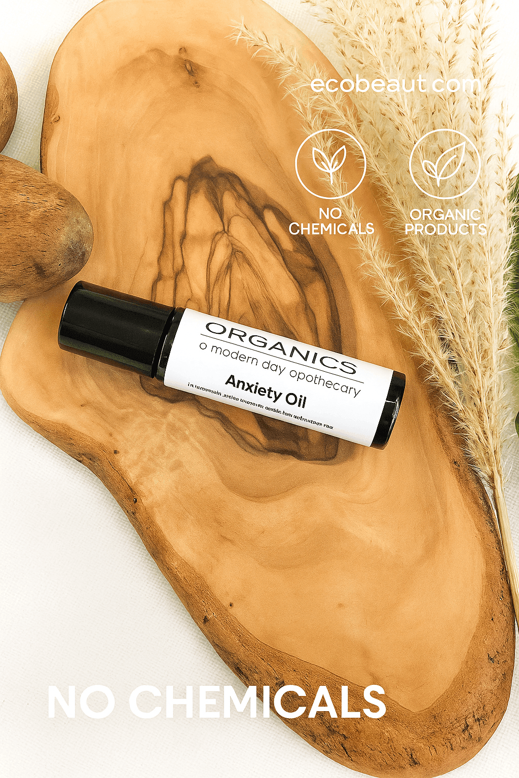 "Anxiety Oil roller bottle on wood slice with pampas grass, eco labels, and ecobeaut.com branding in the top right corner."