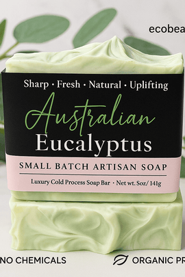 Australian Eucalyptus artisan soap with green and white swirls placed on a marble surface, surrounded by eucalyptus leaves. The label includes ecobeaut.com in the top right and eco-friendly tags 'NO CHEMICALS' and 'ORGANIC PRODUCTS' at the bottom.