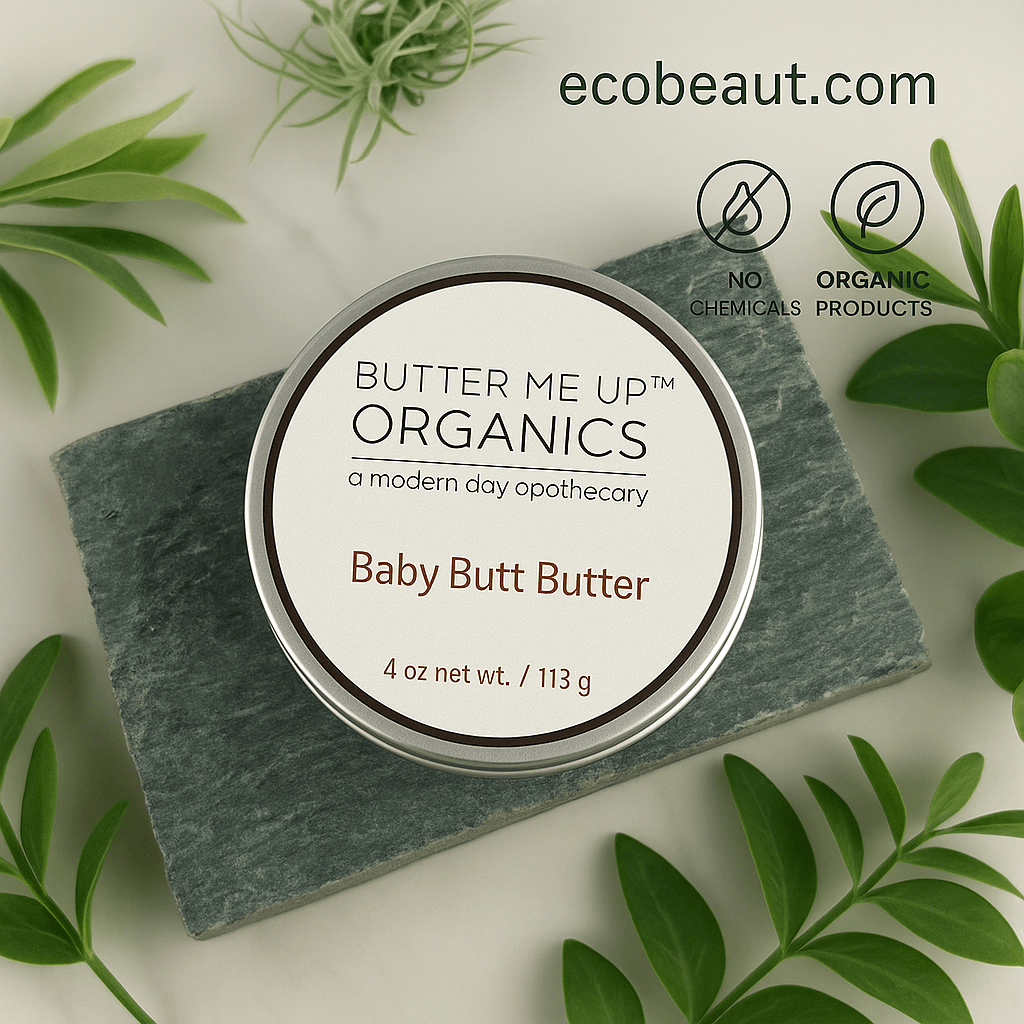Butter Me Up Organics Baby Butt Butter container on a stone surface with green leaves around, featuring ecobeaut.com branding.