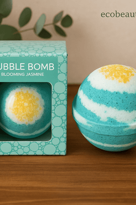 Blooming Jasmine Bubble Bomb with turquoise and white layers next to its mint green box on a wooden surface, ecobeaut.com