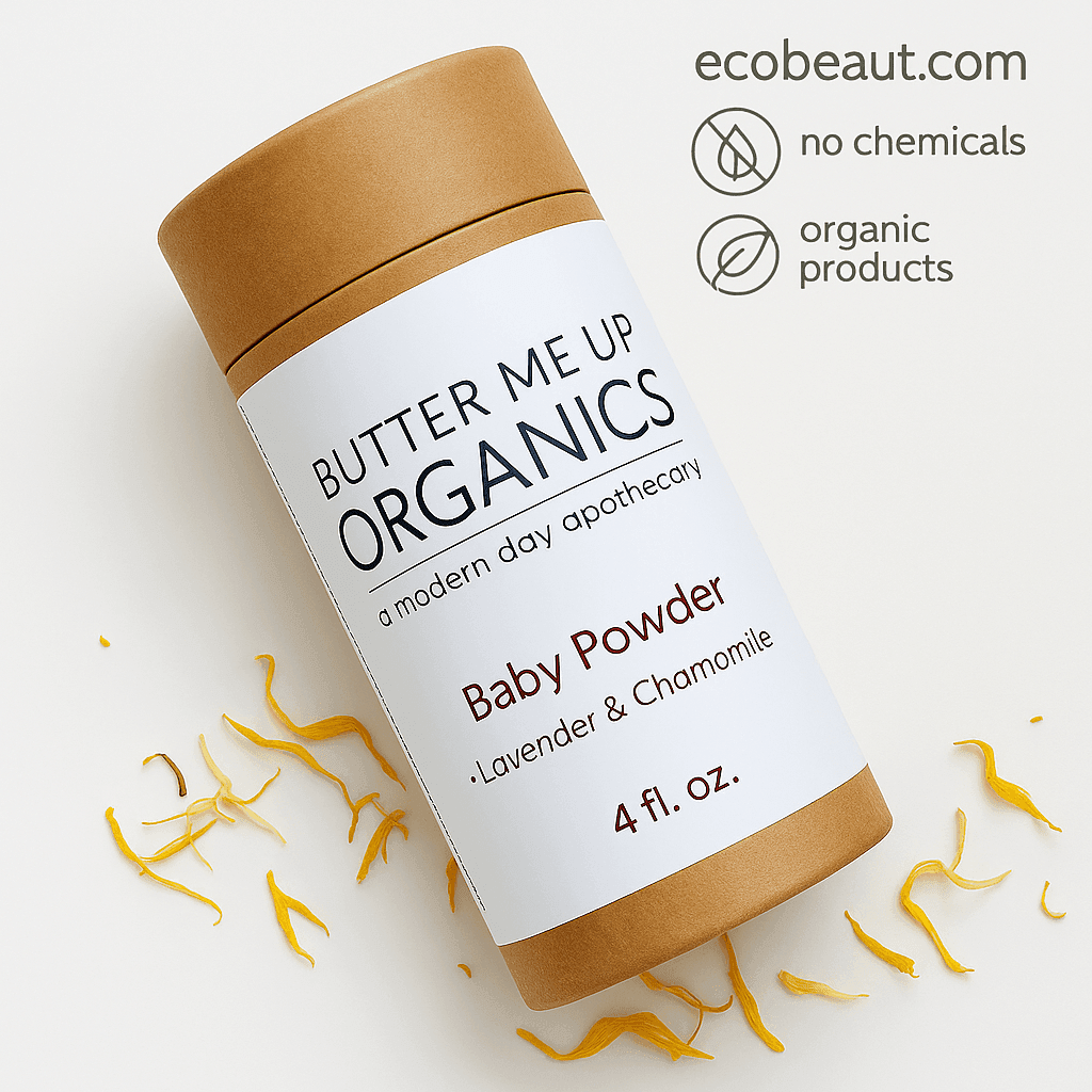 Butter Me Up Organics Baby Powder container lies on a white surface with scattered yellow petals. The top right corner features the ecobeaut.com website and eco-icons for no chemicals and organic products.





