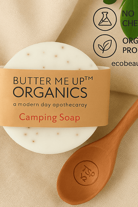 Butter Me Up Organics camping soap with a wooden spoon on a beige background
