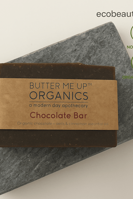 Butter Me Up Organics Chocolate Bar soap on a gray stone with ecobeaut.com, No Chemicals, Organic Products labels in the top right corner.





