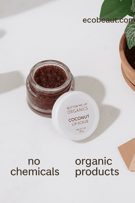 Butter Me Up Organics Coconut Lip Scrub jar with natural reddish texture, styled on a neutral background with plant décor, labeled no chemicals, organic products, and ecobeaut.com
