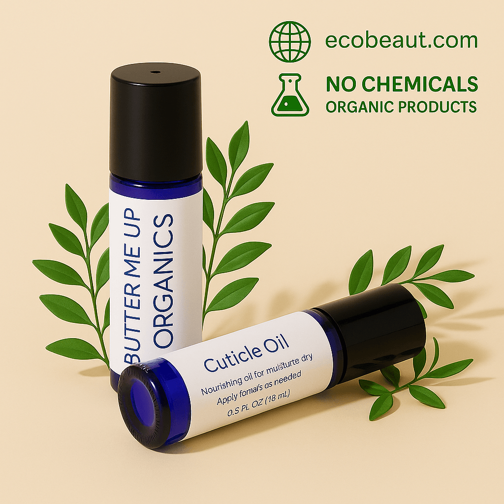 Butter Me Up Organics Cuticle Oil and roll-on bottle surrounded by green leaves on a beige background. Organic, chemical-free nail care with ecobeaut.com branding.