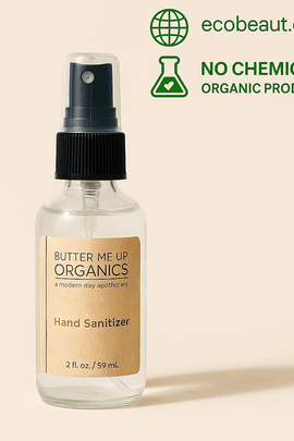 Butter Me Up Organics Hand Sanitizer in a 2 oz spray bottle on a neutral background. Natural, chemical-free product with ecobeaut.com and organic product markings in the top corner.