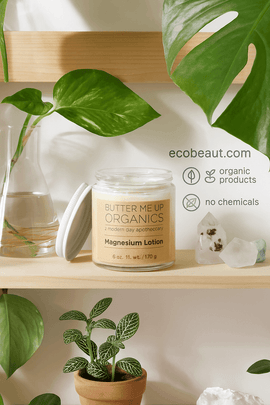 Butter Me Up Organics Magnesium Lotion displayed on wooden shelf surrounded by houseplants and healing crystals, labeled ecobeaut.com, no chemicals, organic products – natural relaxation cream USA