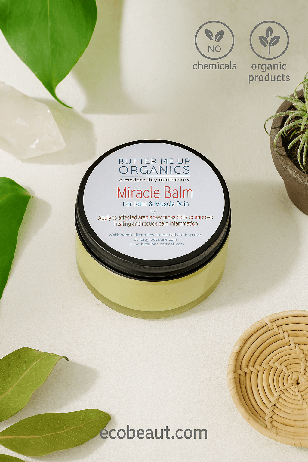Butter Me Up Organics Miracle Balm in a clear glass jar on a beige surface with rosemary and eucalyptus – organic joint and muscle pain relief balm with no chemicals, ecobeaut.com