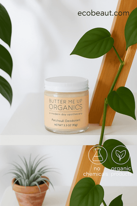 Butter Me Up Organics Patchouli Deodorant on white shelf with green leaves, eco labels, and ecobeaut.com in top right corner.