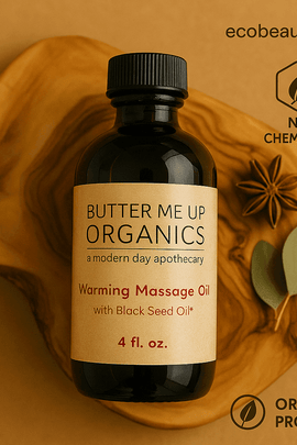 Butter Me Up Organics warming massage oil – wooden background with star anise and leaves – natural product – ecobeaut.com

