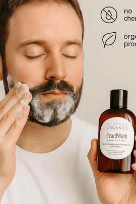 Caucasian man applying Butter Me Up Organics Beard Wash to his beard – natural foaming cleanser for healthy facial hair from ecobeaut.com