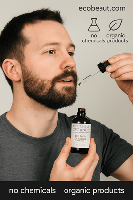Caucasian man applying Butter Me Up Organics beard oil to his beard with dropper – organic, chemical-free grooming from ecobeaut.com