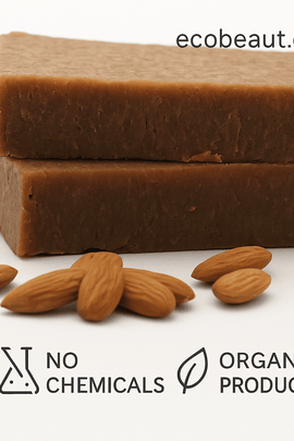 Cinnamon Honey and Almond Soap bars stacked on a white background with whole almonds in front. The image includes the website ecobeaut.com in the top right corner and eco labels 'NO CHEMICALS' and 'ORGANIC PRODUCTS' at the bottom.