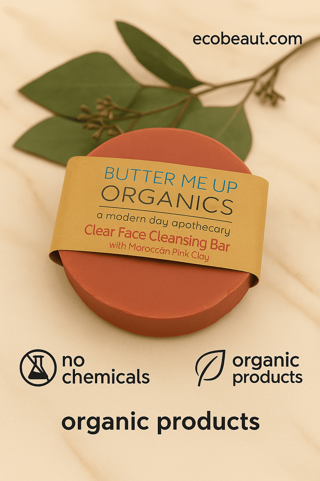 Butter Me Up Organics clear face cleansing bar with green leaves on a beige background