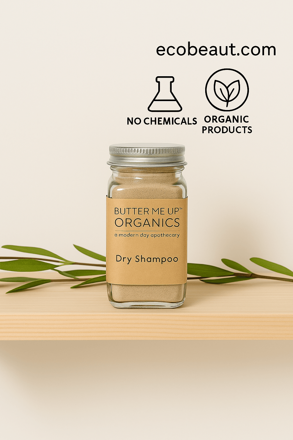Butter Me Up Organics dry shampoo jar on a wooden shelf with green leaves, brand logo, and website text.