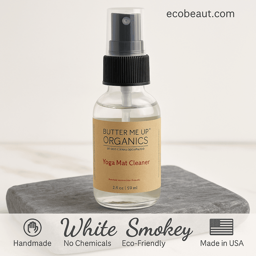 Butter Me Up Organics Yoga Mat Cleaner bottle on a gray surface with 'ecobeaut.com' branding.