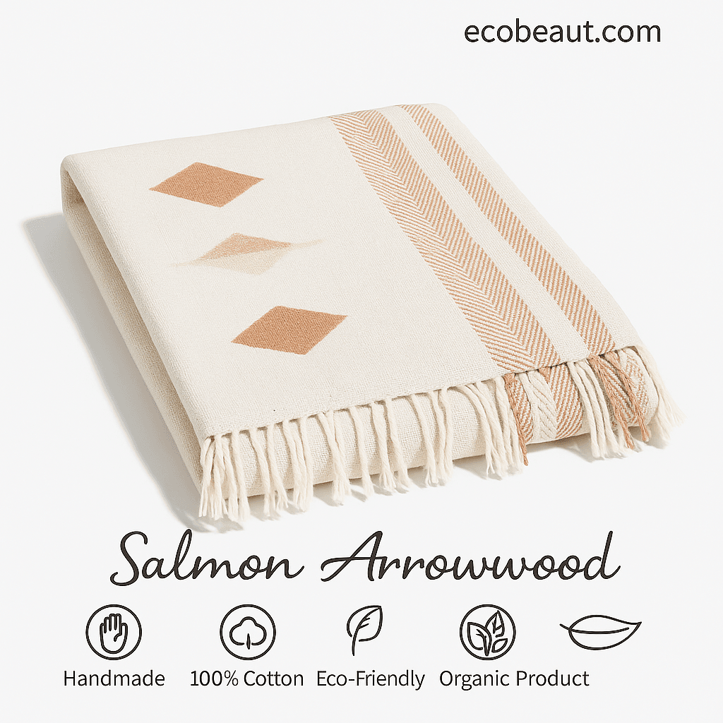 Close-up of folded Salmon Arrowwood blanket made from organic 100% cotton, soft texture, eco-conscious choice